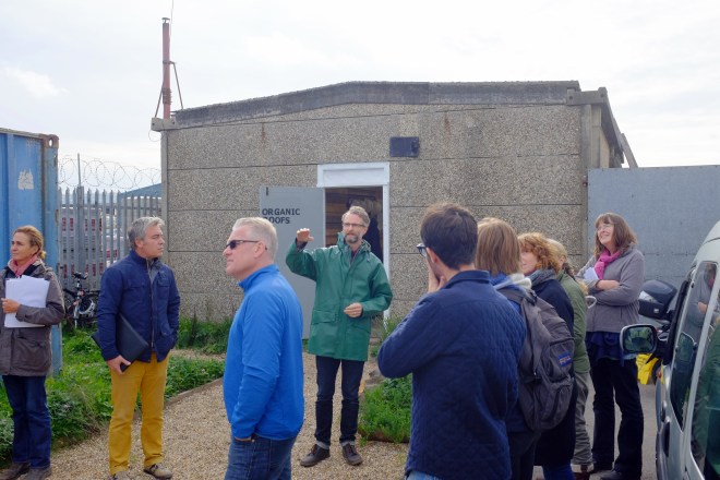 James Farrell, course tutor, talking participants through a container green roof at Organic Roofs HQ