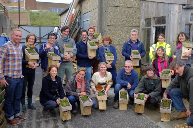 Happy green roofers with their green roofed bird boxes